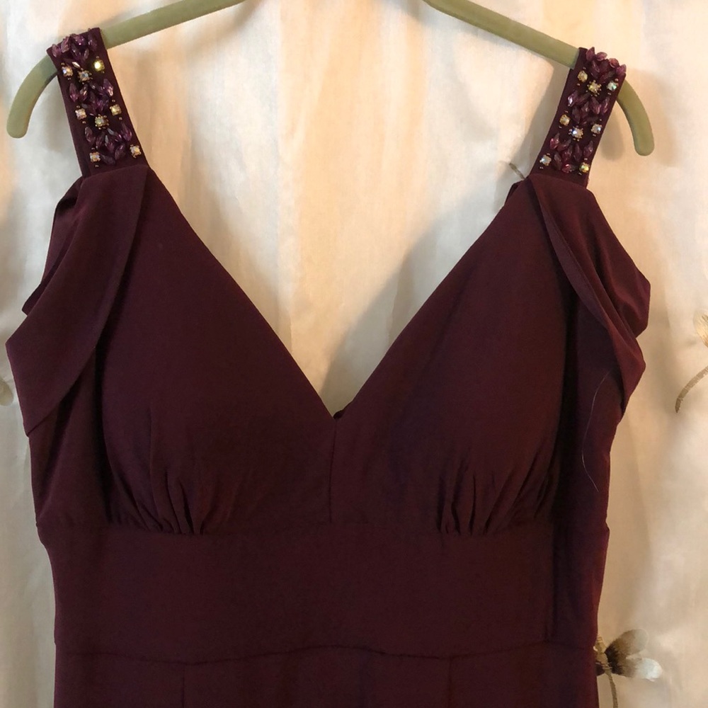 Formal gown with peekaboo sleeves.